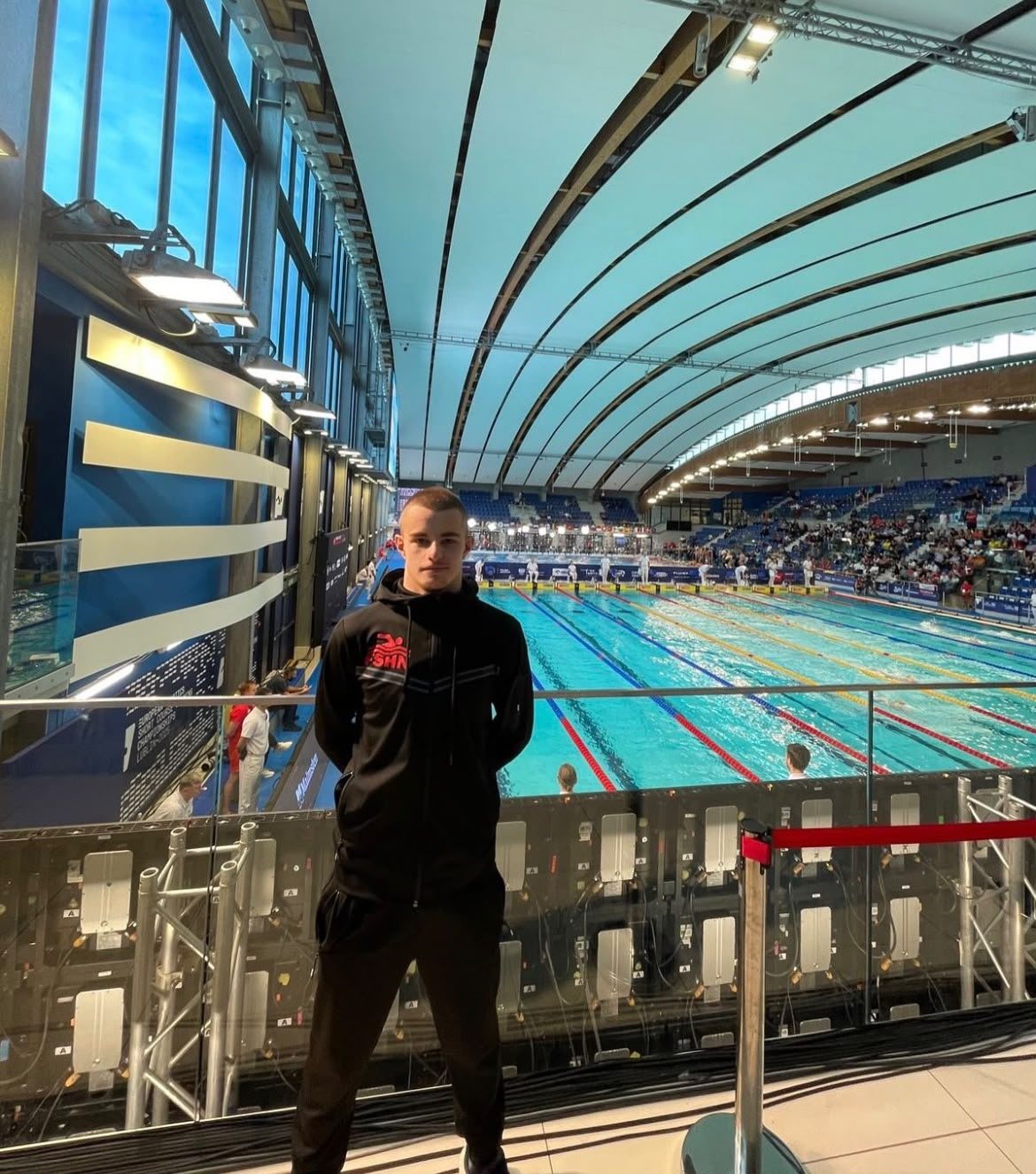 Klint Hoxha portrait overlooking the competition pool, Lublin 2025