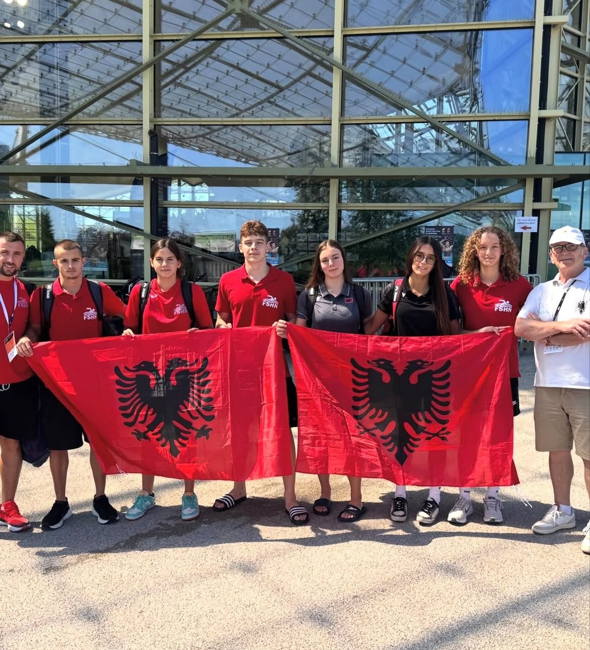 Albanian National Team swimmers holding national flags, Munich 2026